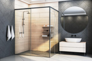 Bagno di design con ampia cabina doccia in vetro, pareti rivestite in gres effetto legno e lavabo d’appoggio su mobile chiaro con specchio rotondo.